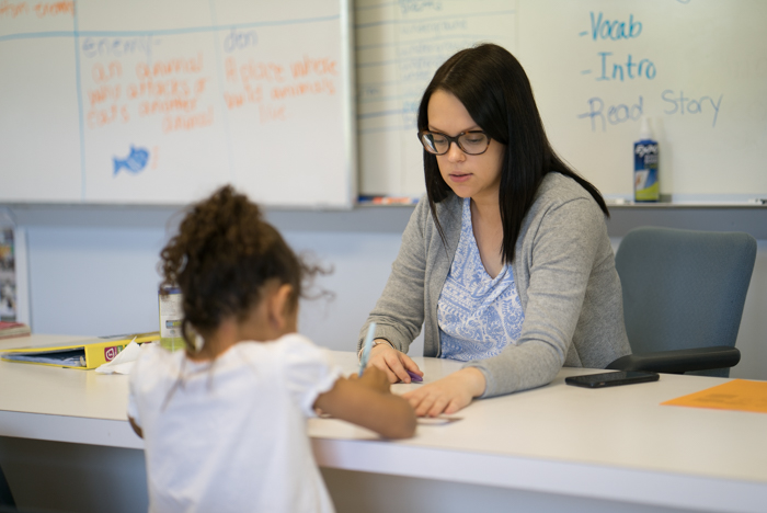 Teacher tutoring student