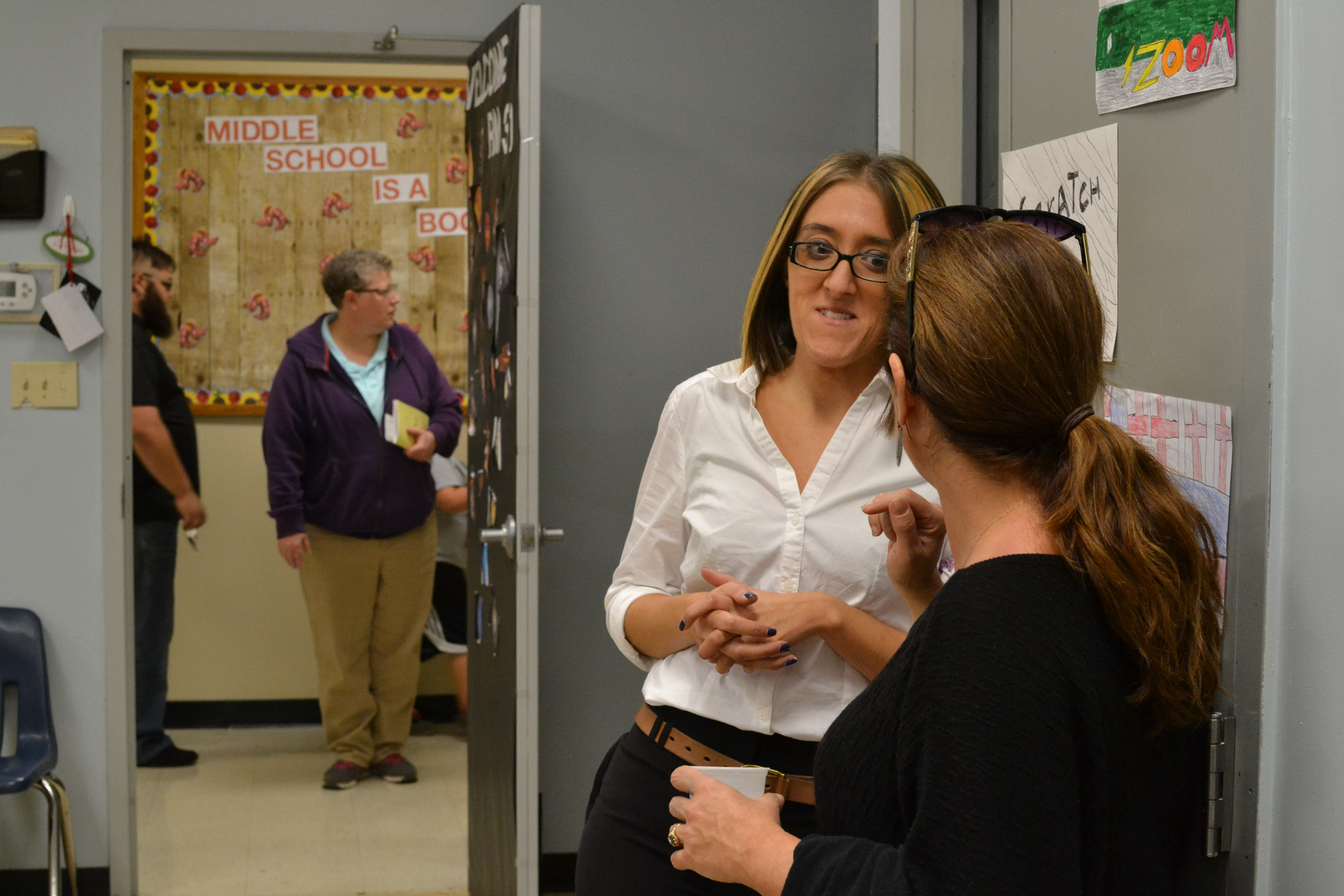 teacher listening to parent