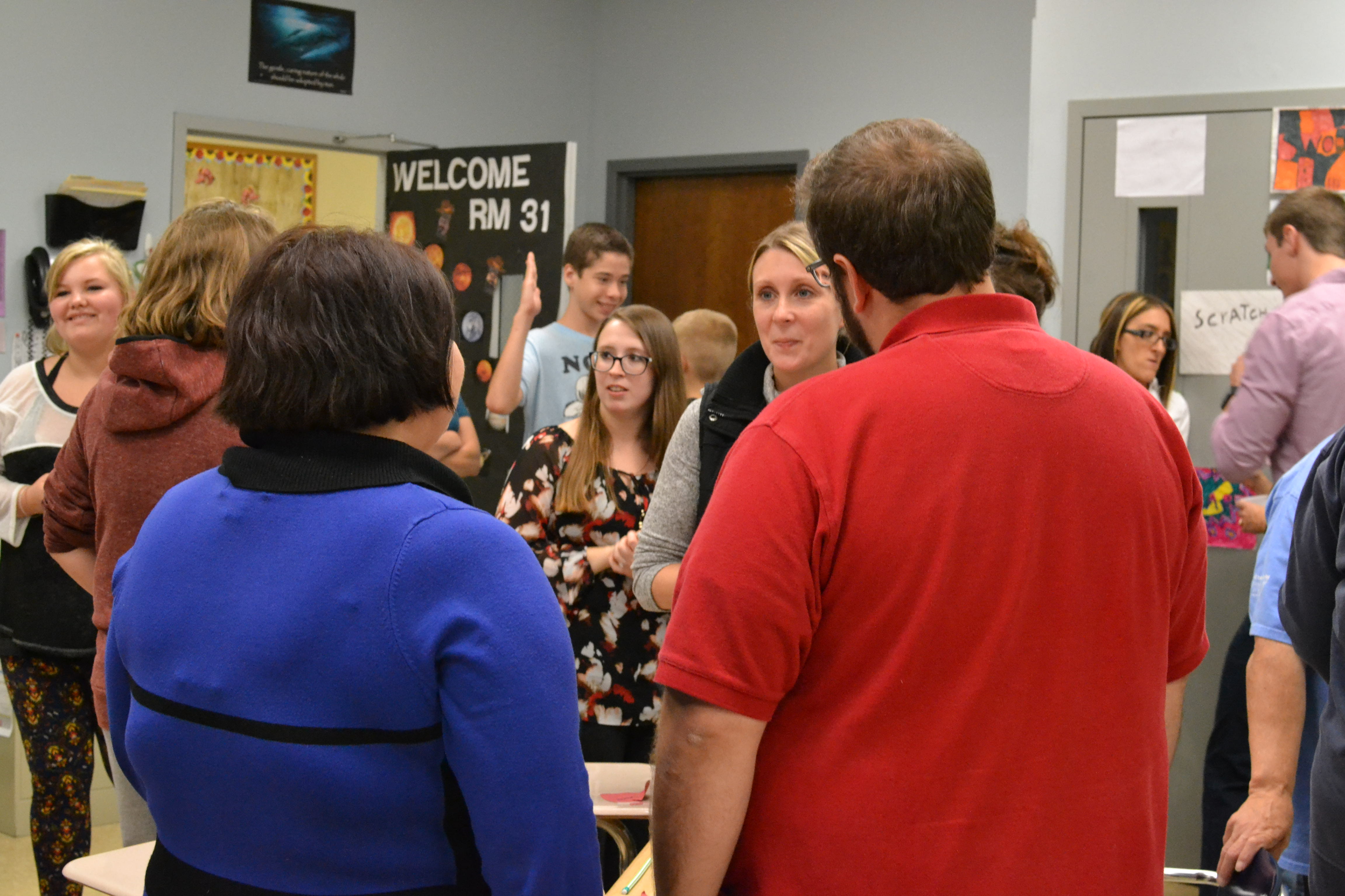parents listening to a teacher