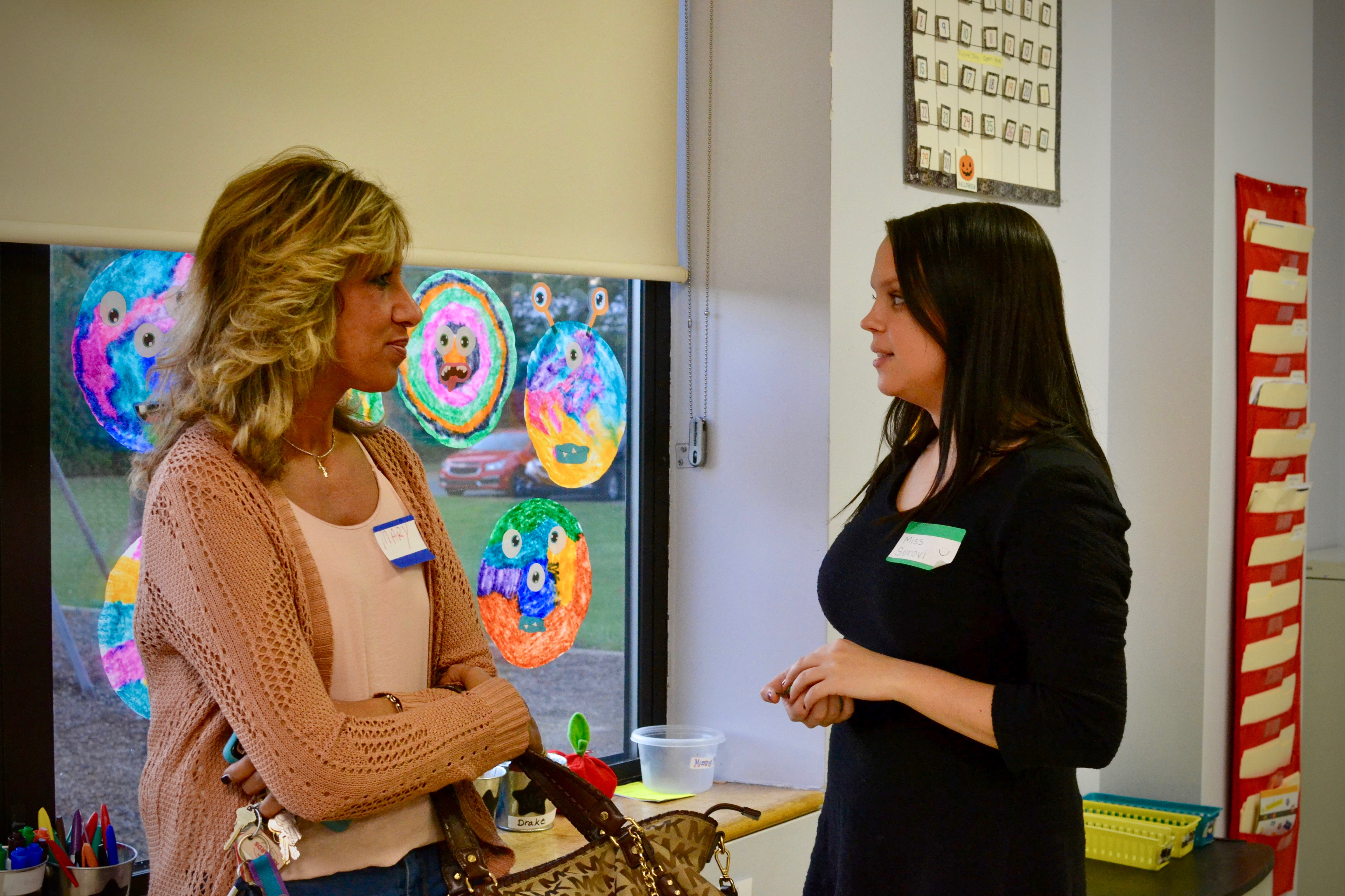 teacher speaking to a parent