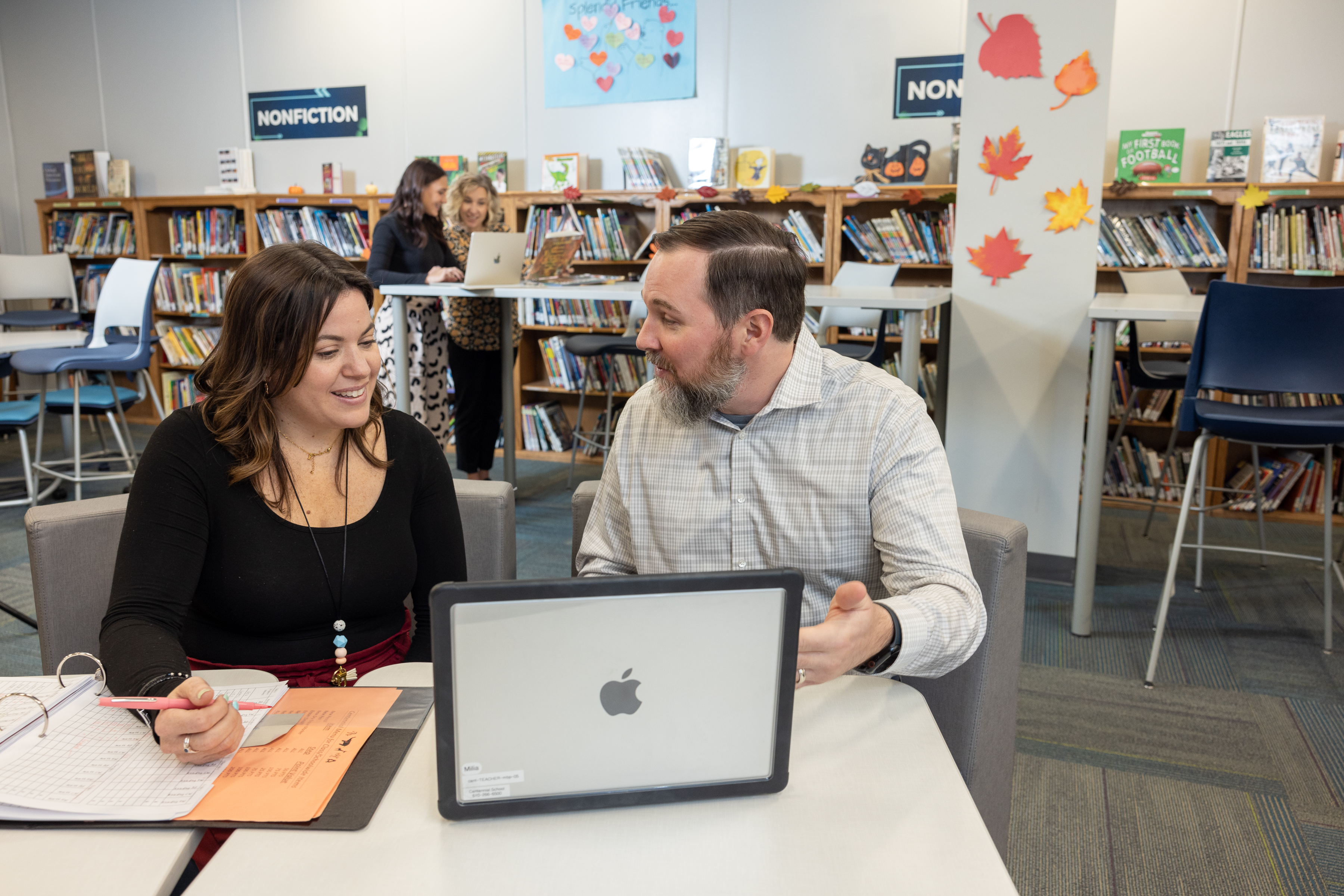 teachers working in the library