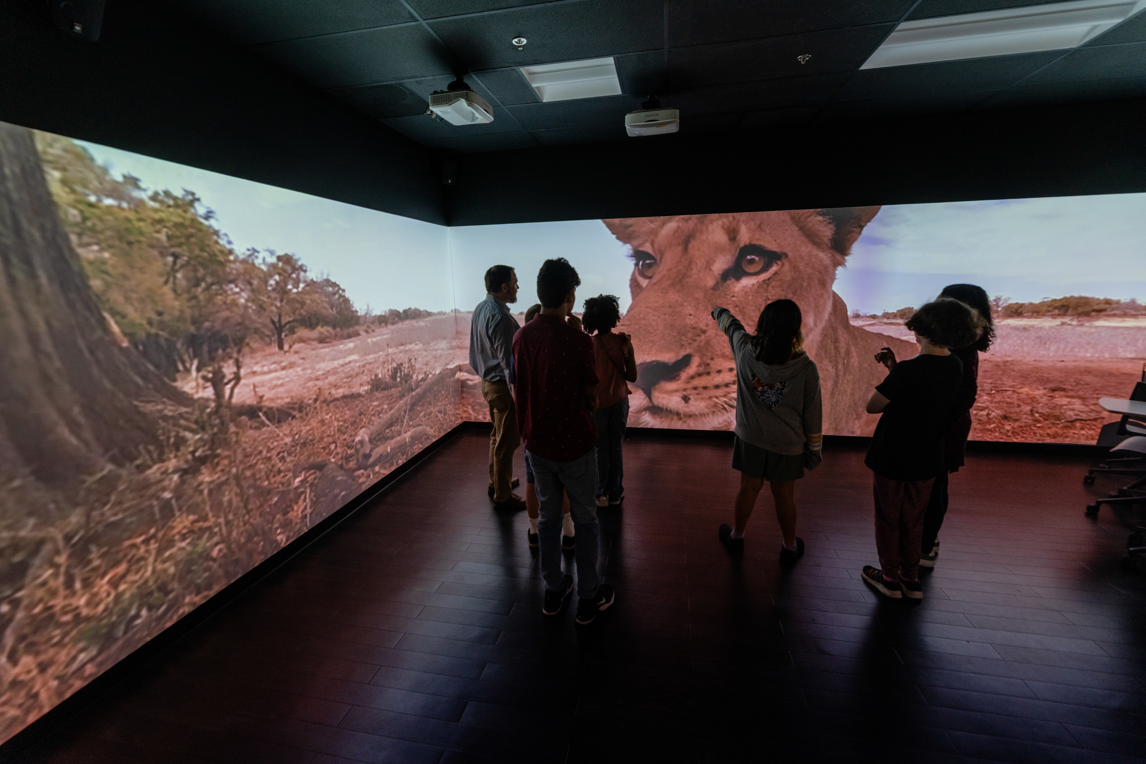 students go on a virtual safari in the immersive learning center