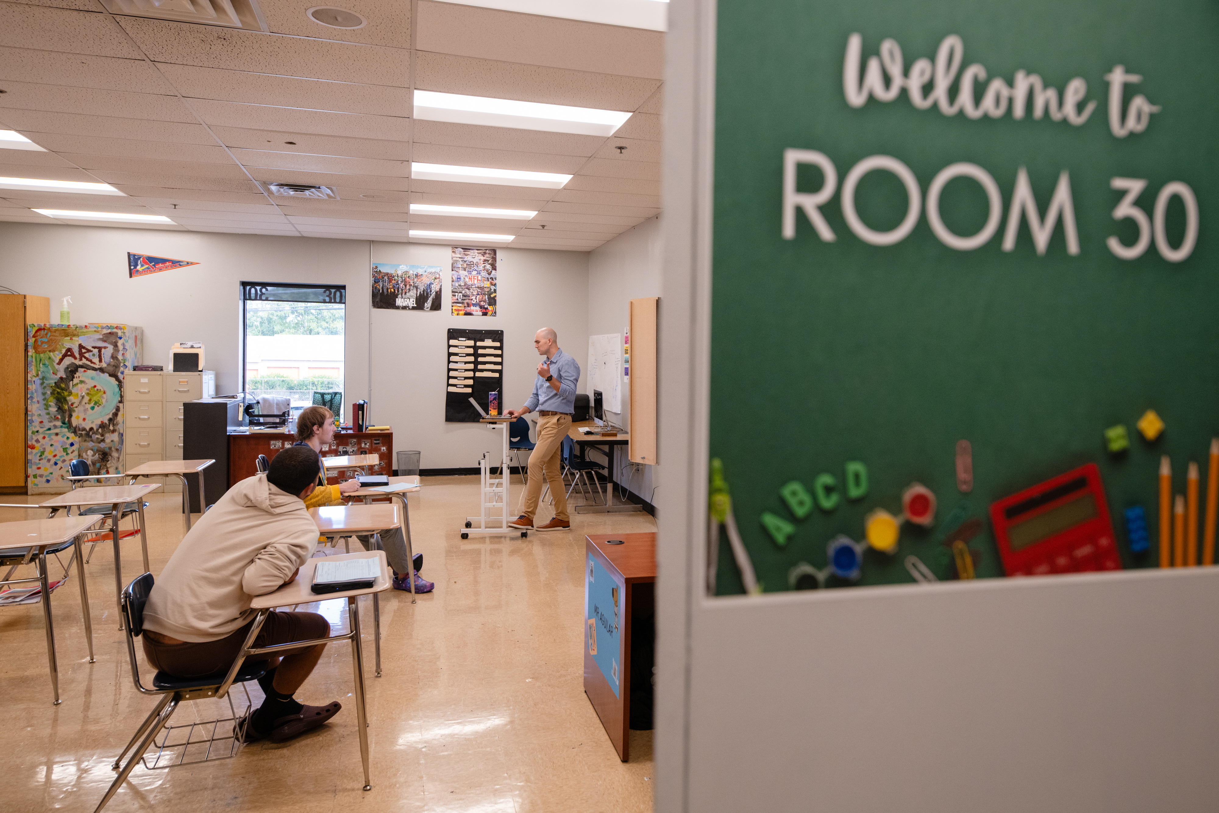 teacher with two high school students